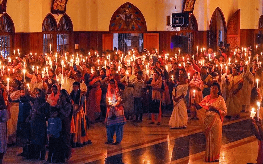 christians with candles in india